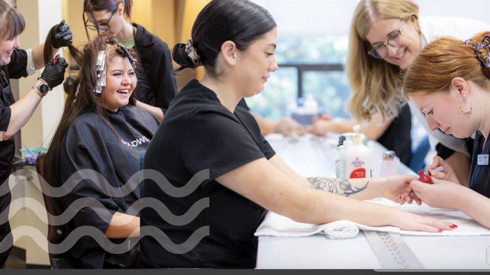 Students doing manicures and hair dressing