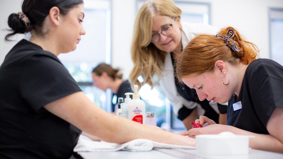 VIU esthetics students practicing manicures